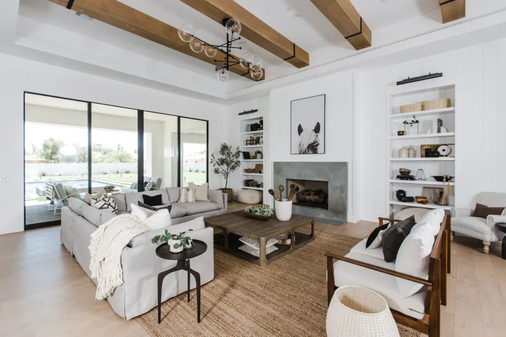 Modern farmhouse living room with fireplace and wood beam ceiling
