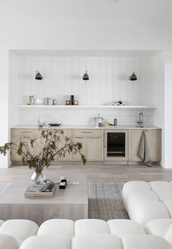 Minimalist neutral kitchen with wood cabinets and white subway tiles
