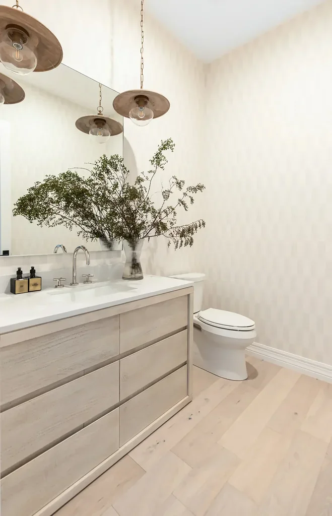 Modern neutral bathroom with wood vanity and hanging pendant lights