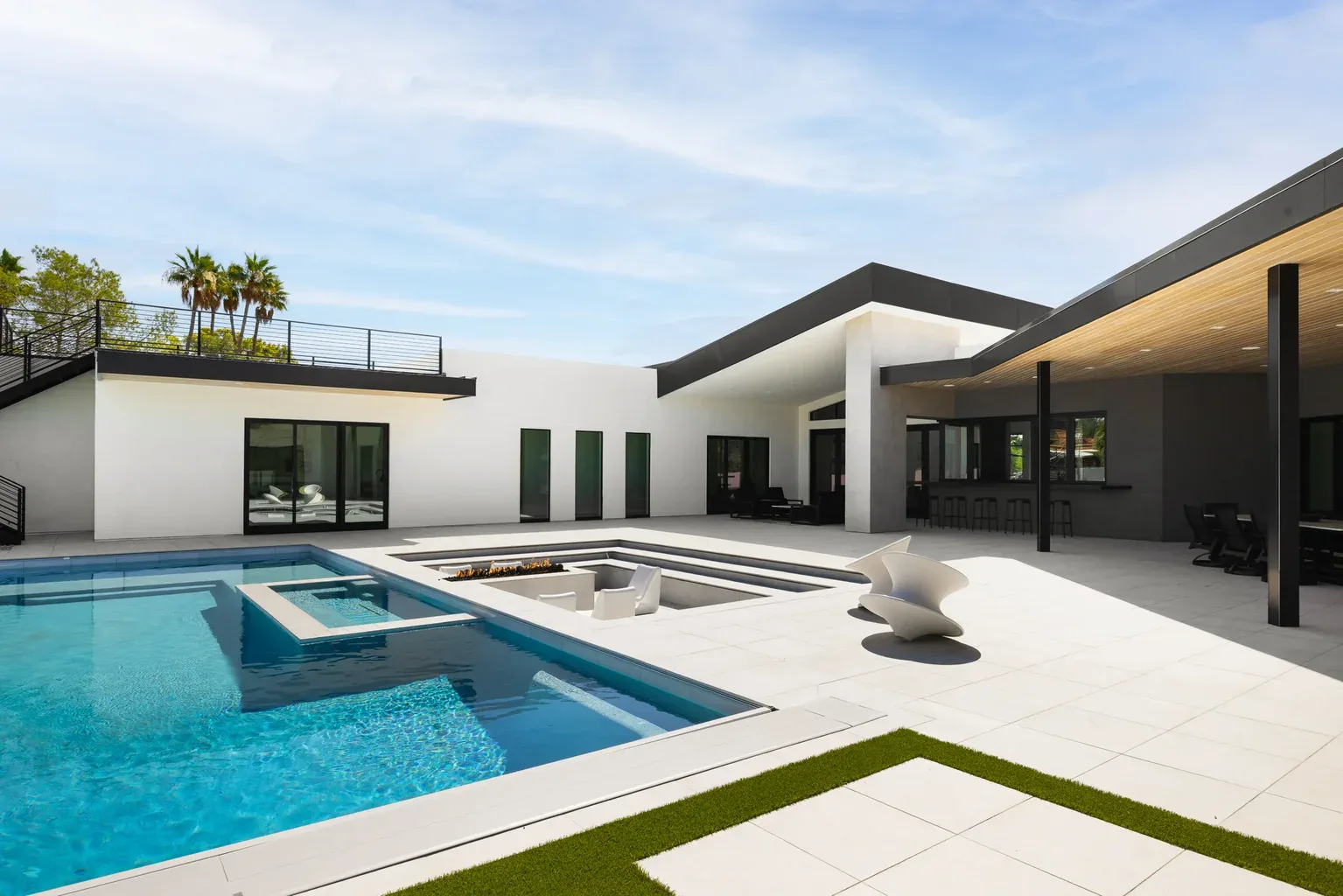 Modern luxury home with pool, spa, and outdoor patio