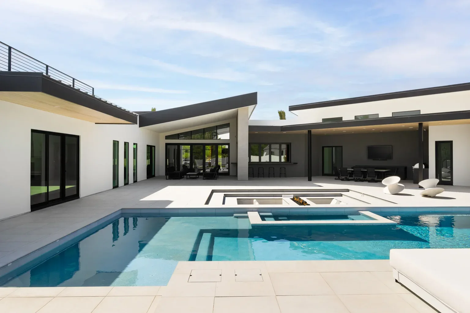 Modern luxury home with outdoor pool and spa patio