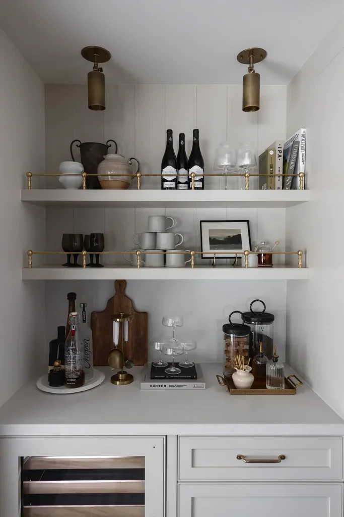 Elegant home bar shelves with brass accents and glassware