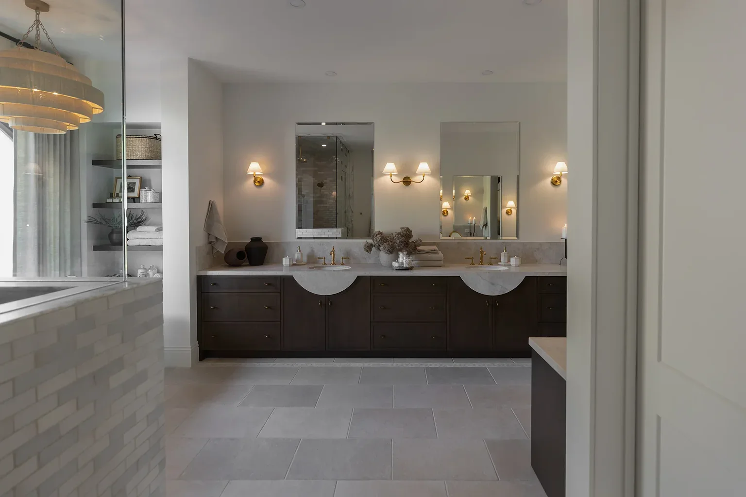 Elegant master bathroom with double vanity and gold fixtures